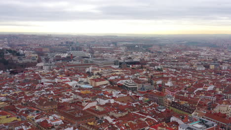 Sunrise-cloudy-aerial-shot-over-Madrid-Spain-neighbourhood-Center,-Atocha
